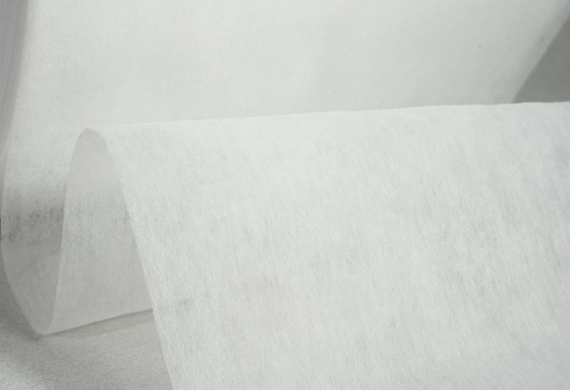 Hot air nonwoven topsheet 